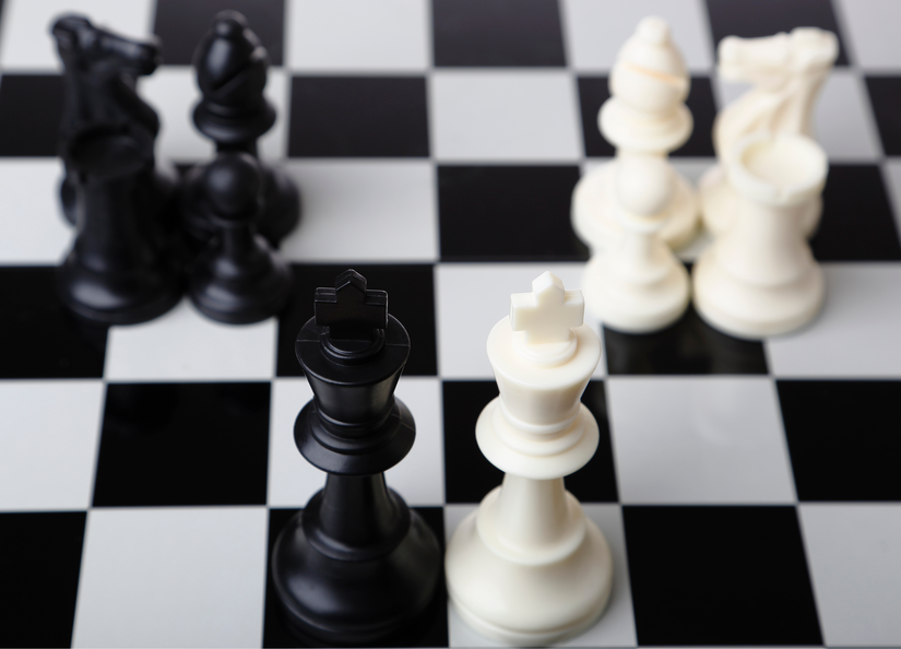 A close up image of a chess board in play