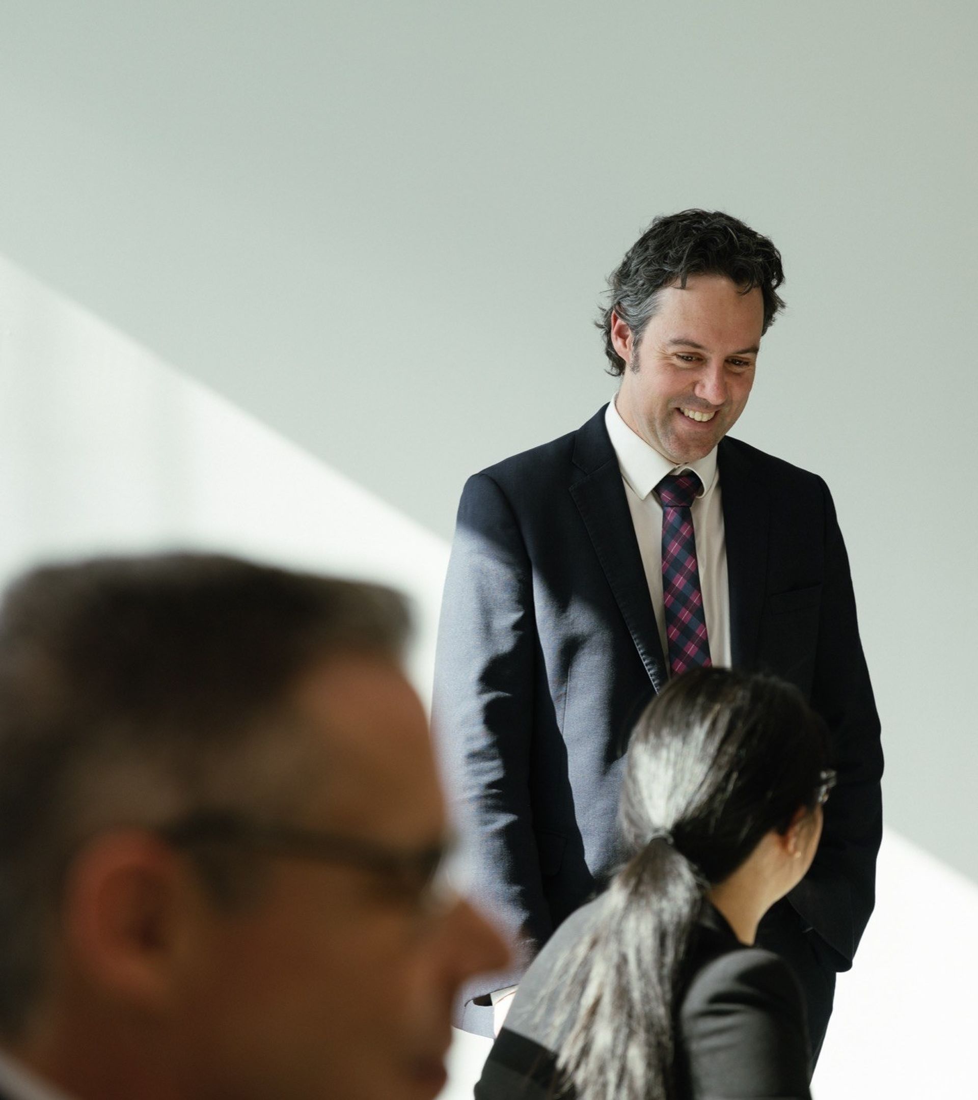 Lawyers enjoying a conversation at a desk