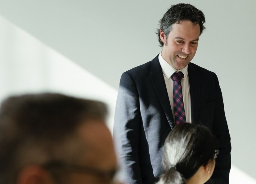 Lawyers enjoying a conversation at a desk