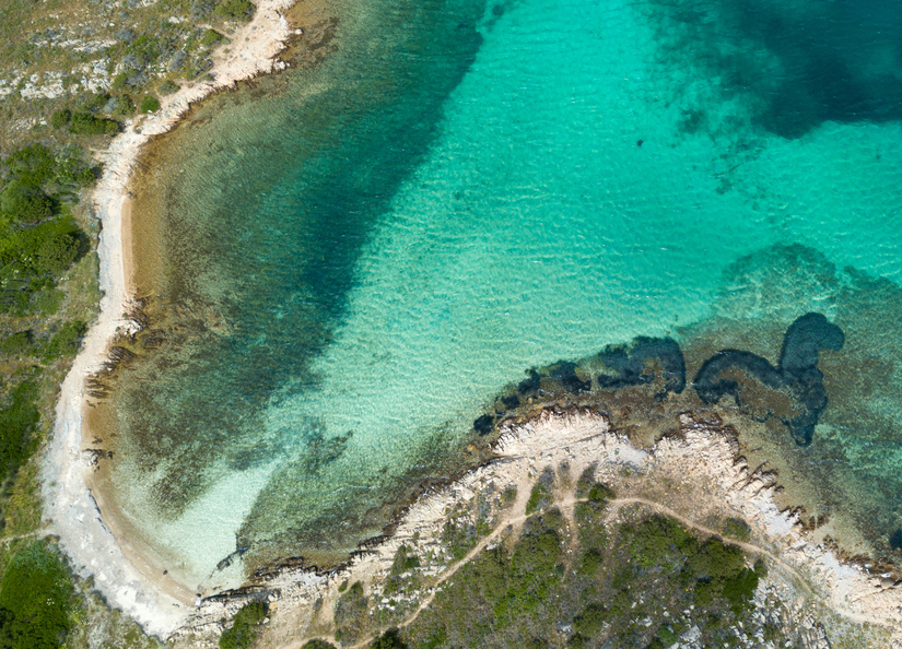 Image of coastline and clear blue/green ocean
