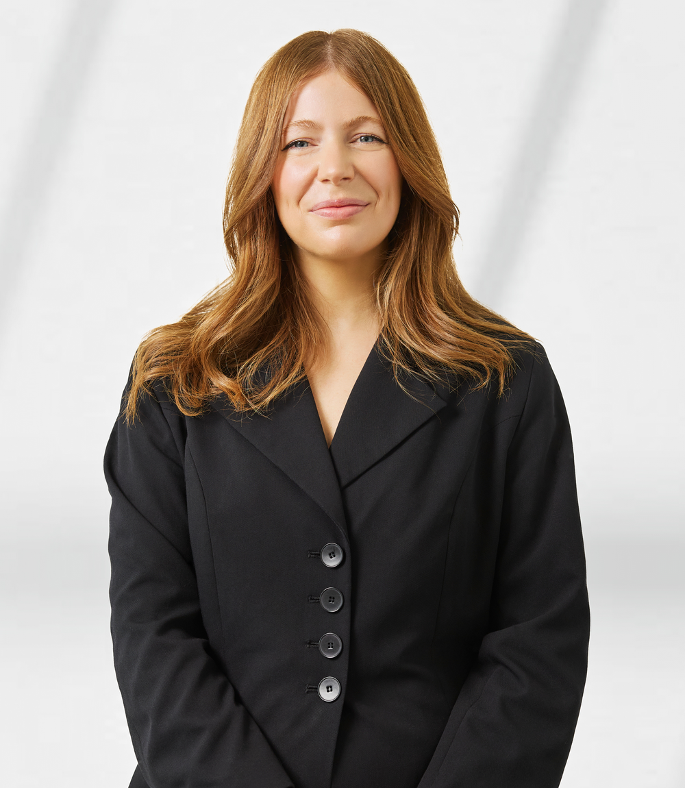 A corporate headshot of Stephanie Dugan - Client Experience and Engagement Manager