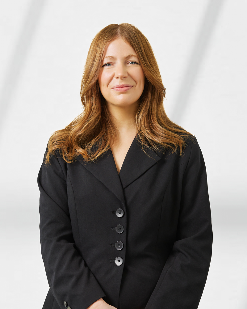 A corporate headshot of Stephanie Dugan - Client Experience and Engagement Manager