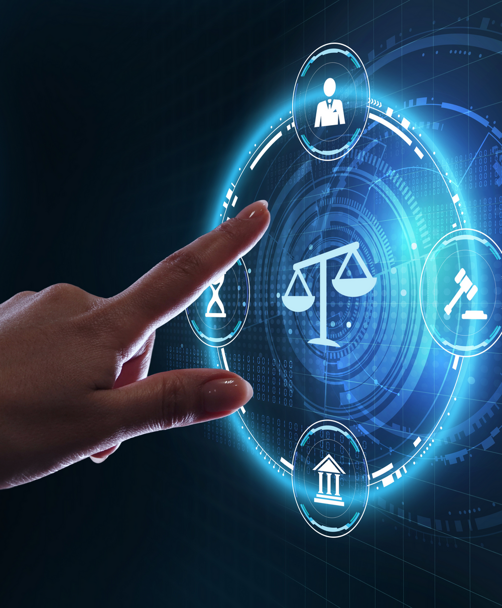 A finger about to touch a scales of justice hologram