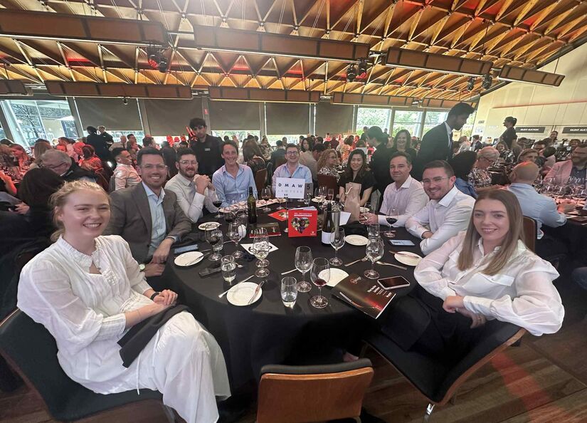 Group of lawyers and property industry professionals seated at a roundtable