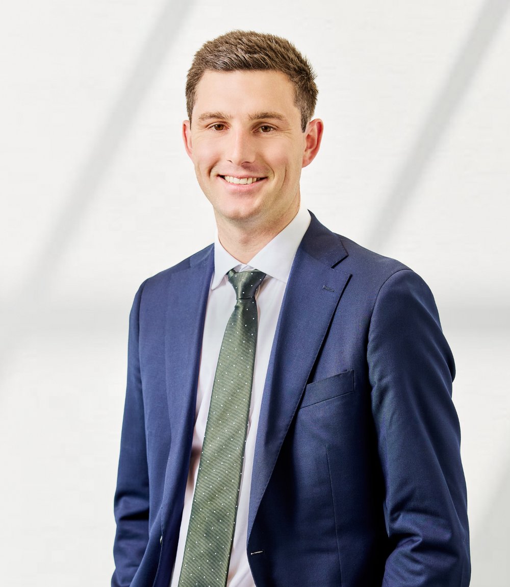 man in blue suit with green tie Ben Millman