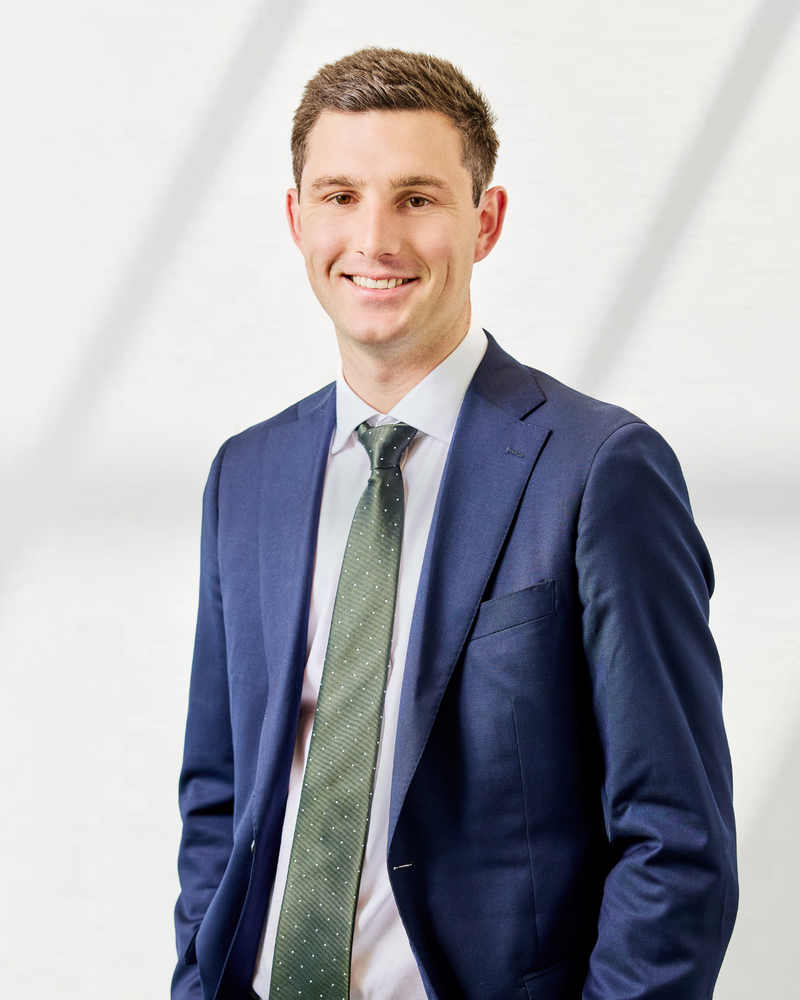 man in blue suit with green tie Ben Millman