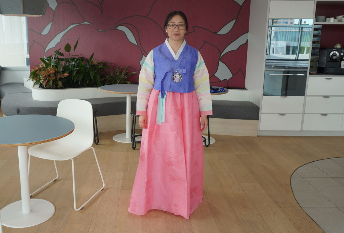 Young Korean-Australian woman in brightly coloured traditional Korean dress