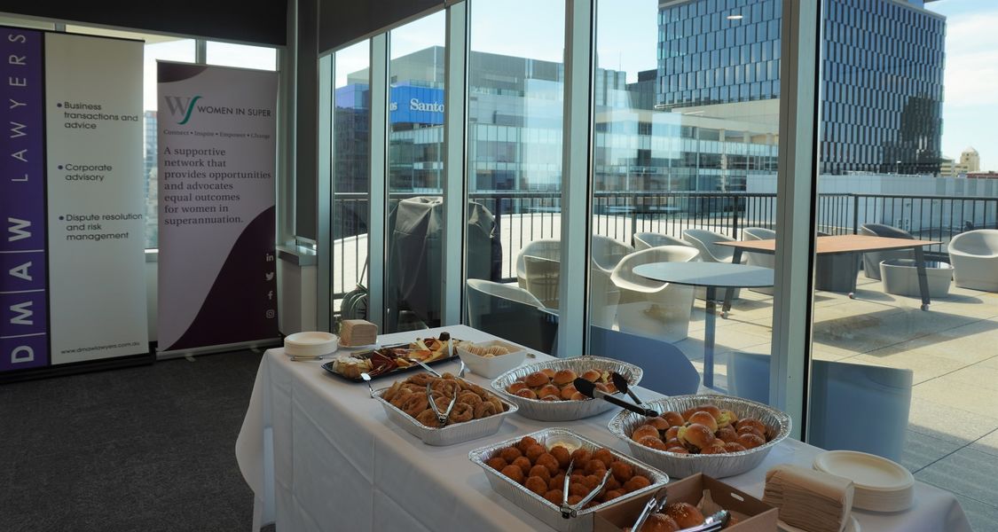Image of two corporate banners and food displayed on a table ready for an event