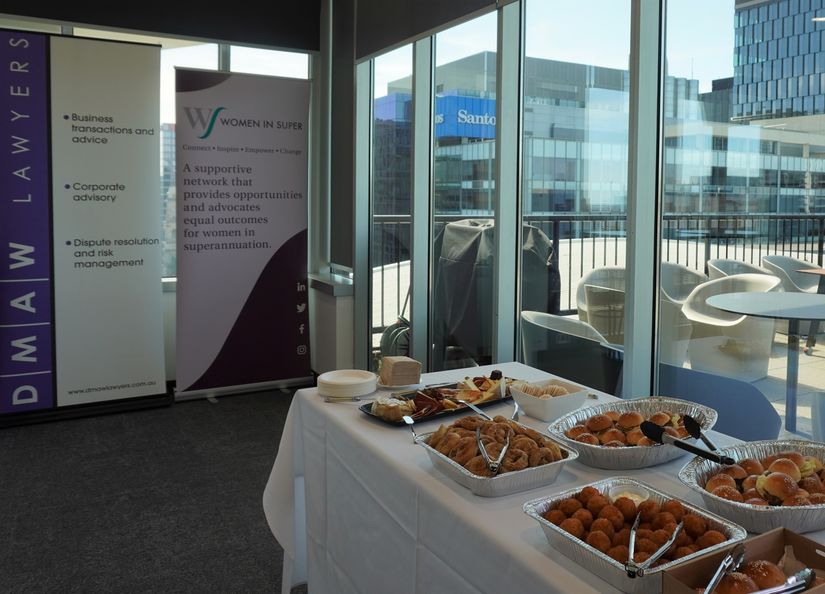 Image of two corporate banners and food displayed on a table ready for an event