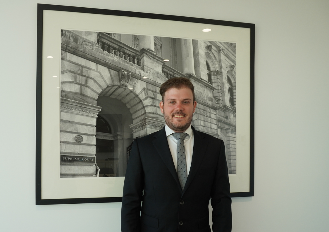 Young lawyer posing for photo in corporate attire
