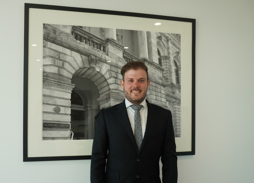 Young lawyer posing for photo in corporate attire
